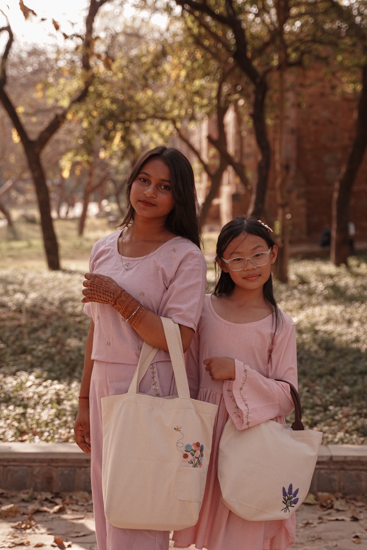 Women and girls holding handmade Sheba Atelier bags